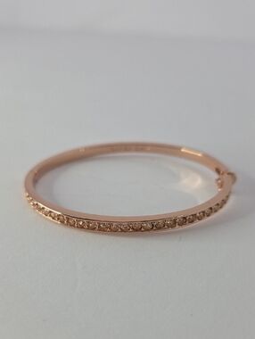 Givenchy Silk Crystal Element bangle bracelet in rose gold tone. 2.5" Diameter